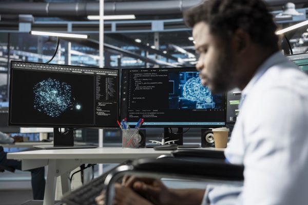 Data center engineer using artificial intelligence visualization tools to identify equipment malfunctions. Server room expert looking at AI generated insights to detect and prevent hardware failures