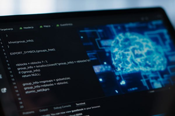 Data center technician using artificial intelligence on tablet to prevent vulnerabilities. Employee using device to review firewall rules, enforcing AI cybersecurity protocols, camera A close up