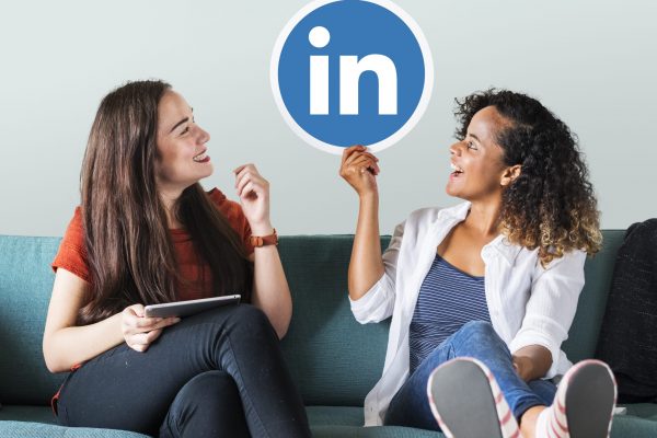 Women holding a Linkedin logo